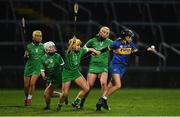 2 February 2020; Ereena Fryday of Tipperary in action against Deborah Murphy, Ella Whelan, and Karen O'Leary of Limerick during the Littlewoods Ireland National Camogie League Division 1 match between Limerick and Tipperary at LIT Gaelic Grounds in Limerick. Photo by Diarmuid Greene/Sportsfile