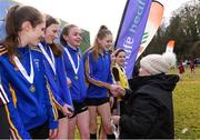 8 February 2020; President of Athletics Ireland Georgina Drumm presents a winners medal to Caoimhe Fitzsimons and her team-mates from the Ratoath AC under-14 girls relay team during the Irish Life Health National Intermediate, Master, Juvenile B & Relays Cross Country at Avondale in Rathdrum, Co Wicklow. Photo by Matt Browne/Sportsfile