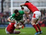 8 February 2020; Robbie Henshaw of Ireland is tackled by Hadleigh Parkes, left, and Nick Tompkins of Wales during the Guinness Six Nations Rugby Championship match between Ireland and Wales at the Aviva Stadium in Dublin. Photo by Ramsey Cardy/Sportsfile