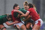 9 February 2020; Lindsay Peat of Ireland is tackled by Robyn Wilkins, left, and Alisha Butchers of Wales during the Women's Six Nations Rugby Championship match between Ireland and Wales at Energia Park in Dublin. Photo by Ramsey Cardy/Sportsfile