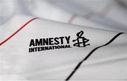 12 February 2020; A detailed view of the Amnesty International logo during the launch of the Bohemians FC 2020 away jersey at Dalymount Park in Dublin. Bohemian FC launched their 2020 away jersey, with the iconic and harrowing image of a family fleeing war taking centre place. They’re launching the away jersey in partnership with Amnesty International Ireland, to campaign together for an end to the Direct Provision system. Photo by Stephen McCarthy/Sportsfile