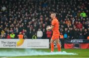 15 February 2020; Bohemians goalkeeper James Talbot walks past a flare that was thrown onto the pitch ahead of the SSE Airtricity League Premier Division match between Bohemians and Shamrock Rovers at Dalymount Park in Dublin. Photo by Seb Daly/Sportsfile