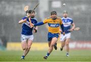 16 February 2020; David Reidy of Clare in action against James Keyes of Laois during the Allianz Hurling League Division 1 Group B Round 3 match between Clare and Laois at Cusack Park in Ennis, Clare. Photo by Eóin Noonan/Sportsfile