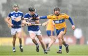 16 February 2020; David Reidy of Clare in action against James Keyes of Laois during the Allianz Hurling League Division 1 Group B Round 3 match between Clare and Laois at Cusack Park in Ennis, Clare. Photo by Eóin Noonan/Sportsfile