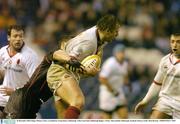 20 December 2003; Roger Wilson, Ulster, is tackled by Craig Joiner, Edinburgh. Celtic Cup Final, Edinburgh Rugby v Ulster, Murrayfield, Edinburgh, Scotland. Picture credit; Matt Browne / SPORTSFILE *EDI*