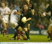 20 December 2003; Allan Jacobsen, Edinburgh, is tackled by  David Humphreys, Ulster. Celtic Cup Final, Edinburgh Rugby v Ulster, Murrayfield, Edinburgh, Scotland. Picture credit; Matt Browne / SPORTSFILE *EDI*