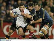 2 January 2004; Andy Ward, Ulster, is tackled by John McWeeney and Ben Gissing, right, Leinster. Celtic League, Leinster v Ulster, Donnybrook, Dublin.  Picture credit; Matt Browne / SPORTSFILE *EDI*
