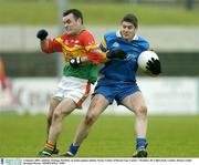 4 January 2004; Anthony Furlong, Wicklow, in action against Johnny Nevin, Carlow. O'Byrne Cup, Carlow v Wicklow, Dr Cullen Park, Carlow. Picture credit; Brendan Moran / SPORTSFILE *EDI*