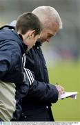 4 January 2004; Westmeath manager Paidi î SŽ signs an autograph for supporter Dean Reddan from Tanh, Co. Westmeath. O'Byrne Cup, Westmeath v Louth, Cusack Park, Mullingar, Co. Westmeath. Picture credit; Ray McManus / SPORTSFILE *EDI*