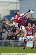 4 January 2004; David O'Shaughnessy, Westmeath, in action against Graham Carr, Louth. O'Byrne Cup, Westmeath v Louth, Cusack Park, Mullingar, Co. Westmeath. Picture credit; Ray McManus / SPORTSFILE *EDI*