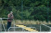 4 January 2004; A lone supporter keeps an eye on the match while listening to his radio. O'Byrne Cup, Carlow v Wicklow, Dr Cullen Park, Carlow. Picture credit; Brendan Moran / SPORTSFILE *EDI*