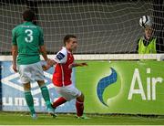 28 June 2013; St. Patrick’s Athletic's Christy Fagan scores his side's first goal despite the attempts of Bray Wanderers Kevin Knight. Airtricity League Premier Division, St. Patrick’s Athletic v Bray Wanderers, Richmond Park, Dublin. Picture credit: David Maher / SPORTSFILE