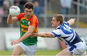 28 June 2013; Shane Redmond, Carlow, in action against Donal Kingston, Laois. GAA Football All-Ireland Senior Championship, Round 1, Carlow v Laois, Dr. Cullen Park, Carlow. Picture credit: Diarmuid Greene / SPORTSFILE