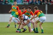 28 June 2013; Padraig Clancy, Laois, in action against Darragh Foley, left, John Murphy, centre, and Sean Gannon, Carlow. GAA Football All-Ireland Senior Championship, Round 1, Carlow v Laois, Dr. Cullen Park, Carlow. Picture credit: Diarmuid Greene / SPORTSFILE