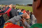 28 June 2013; Carlow supporter Peter Doran looks at his watch as the game begins at 7.45pm. GAA Football All-Ireland Senior Championship, Round 1, Carlow v Laois, Dr. Cullen Park, Carlow. Picture credit: Diarmuid Greene / SPORTSFILE