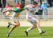 29 June 2013; Conor Clarke, Tyrone, in action against Eoin Carroll, Offaly. GAA Football All-Ireland Senior Championship, Round 1, Offaly v Tyrone, O'Connor Park, Tullamore, Co. Offaly. Picture credit: David Maher / SPORTSFILE