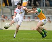 29 June 2013; Sean Cavanagh, Tyrone, in action against Niall McNamee, Offaly. GAA Football All-Ireland Senior Championship, Round 1, Offaly v Tyrone, O'Connor Park, Tullamore, Co. Offaly. Picture credit: David Maher / SPORTSFILE
