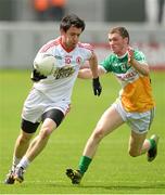 29 June 2013; Matthew Donnelly, Tyrone, in action against Daithi Brady, Offaly. GAA Football All-Ireland Senior Championship, Round 1, Offaly v Tyrone, O'Connor Park, Tullamore, Co. Offaly. Picture credit: David Maher / SPORTSFILE