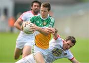 29 June 2013; Ciaran Hurley, Offaly, in action against Conor Gormley, Tyrone. GAA Football All-Ireland Senior Championship, Round 1, Offaly v Tyrone, O'Connor Park, Tullamore, Co. Offaly. Picture credit: David Maher / SPORTSFILE
