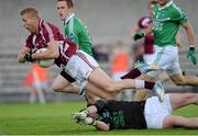 29 June 2013; Denis Glennon, Westmeath, is fouled by Fermanagh goalkeeper Chris Snow, resulting in a penalty. GAA Football All-Ireland Senior Championship, Round 1, Westmeath v Fermanagh, Cusack Park, Mullingar, Co. Westmeath. Picture credit: Brian Lawless / SPORTSFILE