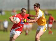 29 June 2013; Ray Finnegan, Louth, in action against John Carron, Antrim. GAA Football All-Ireland Senior Championship, Round 1, Louth v Antrim, County Grounds, Drogheda, Co. Louth. Picture credit: Dáire Brennan / SPORTSFILE