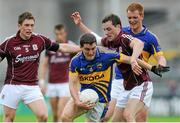 29 June 2013; Donal Lynch, Tipperary, in action against Conor Doherty and John O'Brien, Galway. GAA Football All-Ireland Senior Championship, Round 1, Galway v Tipperary, Pearse Stadium, Galway. Picture credit: Ray Ryan / SPORTSFILE