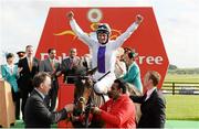 29 June 2013; Jockey Kevin Manning, onboard Trading Leather, celebrates after winning the Dubai Duty Free Irish Derby. Curragh Racecourse, The Curragh, Co. Kildare. Picture credit: Diarmuid Greene / SPORTSFILE