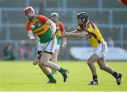 29 June 2013; Eddie Byrne, Carlow, in action against Shaun Murphy, Wexford. GAA Hurling All-Ireland Senior Championship, Phase I, Wexford v Carlow, Wexford Park, Wexford. Picture credit: Matt Browne / SPORTSFILE