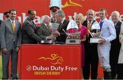 29 June 2013; Trainer Jim Bolger is presented with the prize by President Michael D. Higgins after he sent out Trading Leather win the Dubai Duty Free Irish Derby. Curragh Racecourse, The Curragh, Co. Kildare. Picture credit: Diarmuid Greene / SPORTSFILE