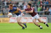 29 June 2013; George Hannigan, Tipperary, in action against Sean Armstrong, Galway. GAA Football All-Ireland Senior Championship, Round 1, Galway v Tipperary, Pearse Stadium, Galway. Picture credit: Ray Ryan / SPORTSFILE