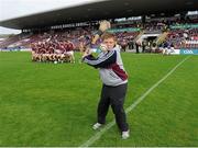 29 June 2013; Galway supporter, Cian Conneely, from Inverin, hits a sliothar as the Galway football team line up for the team photo. GAA Football All-Ireland Senior Championship, Round 1, Galway v Tipperary, Pearse Stadium, Galway. Picture credit: Ray Ryan / SPORTSFILE
