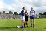 29 June 2013; Cavan captain Alan Clarke, left, and Monaghan captain Owen Lennon, shake hands in the company of referee Marty Duffy before the game. Ulster GAA Football Senior Championship, Semi-Final, Cavan v Monaghan, St Tiernach's Park, Clones, Co. Monaghan. Picture credit: Brendan Moran / SPORTSFILE