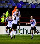 21 February 2020; Andy Boyle of Dundalk, top, celebrates after scoring his side's first goal with team-mates including Chris Shields, 5, during the SSE Airtricity League Premier Division match between Shelbourne and Dundalk at Tolka Park in Dublin. Photo by Harry Murphy/Sportsfile