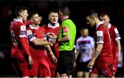 21 February 2020; Shelbourne players remonstrate with referee Damien MacGraith during the SSE Airtricity League Premier Division match between Shelbourne and Dundalk at Tolka Park in Dublin. Photo by Harry Murphy/Sportsfile