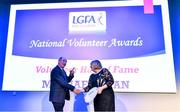 21 February 2020; Michael Ryan, from Ballymacarbry in Co. Waterford, is presented with the Volunteer Hall of Fame award by Ladies Gaelic Football Association President Marie Hickey at the 2019 LGFA Volunteer of the Year awards night at Croke Park in Dublin. Photo by Piaras Ó Mídheach/Sportsfile