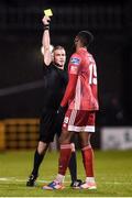 21 February 2020; Reyon Dillon of Cork City receives a yellow card from referee Sean Grant during the SSE Airtricity League Premier Division match between Shamrock Rovers and Cork City at Tallaght Stadium in Dublin. Photo by Stephen McCarthy/Sportsfile