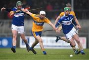 16 February 2020; Aidan McCarthy of Clare in action against Willie Dunphy, left, and Ross King of Laois during the Allianz Hurling League Division 1 Group B Round 3 match between Clare and Laois at Cusack Park in Ennis, Clare. Photo by Eóin Noonan/Sportsfile