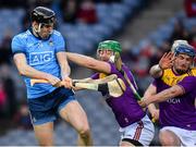 22 February 2020; Ronan Hayes of Dublin gets a shot away under pressure from Matthew O’Hanlon, centre, and Kevin Foley of Wexford during the Allianz Hurling League Division 1 Group B Round 4 match between Dublin and Wexford at Croke Park in Dublin. Photo by Sam Barnes/Sportsfile