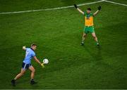 22 February 2020; Ciarán Kilkenny of Dublin kicks a point after claiming an advanced mark under pressure from Ryan McHugh of Donegal during the Allianz Football League Division 1 Round 4 match between Dublin and Donegal at Croke Park in Dublin. Photo by Harry Murphy/Sportsfile