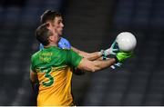 22 February 2020; Paul Mannion of Dublin scores his side's first goal despite the attention of Neil McGee of Donegal during the Allianz Football League Division 1 Round 4 match between Dublin and Donegal at Croke Park in Dublin. Photo by Sam Barnes/Sportsfile