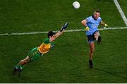 22 February 2020; Ciarán Kilkenny of Dublin kicks a point under pressure from Ryan McHugh of Donegal during the Allianz Football League Division 1 Round 4 match between Dublin and Donegal at Croke Park in Dublin. Photo by Harry Murphy/Sportsfile