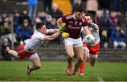 23 February 2020; Damien Comer of Galway is tackled by Liam Rafferty, left, and Ronan McNamee of Tyrone resulting in a penalty during the Allianz Football League Division 1 Round 4 match between Galway and Tyrone at Tuam Stadium in Tuam, Galway.  Photo by David Fitzgerald/Sportsfile