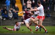 23 February 2020; Damien Comer of Galway is tackled by Liam Rafferty, left, and Ronan McNamee of Tyrone resulting in a penalty during the Allianz Football League Division 1 Round 4 match between Galway and Tyrone at Tuam Stadium in Tuam, Galway.  Photo by David Fitzgerald/Sportsfile