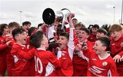 23 February 2020; Matthew Moore of Cork SL lifting the cup alongside team-mates during the U13 SFAI Subway Liam Miller Cup National Championship Final match between Cork SL and DDSL at Mullingar Athletic FC in Gainestown, Co. Westmeath. Photo by Eóin Noonan/Sportsfile
