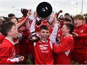 23 February 2020; Matthew Moore of Cork SL lifting the cup alongside team-mates during the U13 SFAI Subway Liam Miller Cup National Championship Final match between Cork SL and DDSL at Mullingar Athletic FC in Gainestown, Co. Westmeath. Photo by Eóin Noonan/Sportsfile