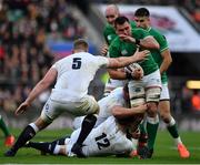 23 February 2020; CJ Stander of Ireland is tackled by Owen Farrell and George Kruis of England during the Guinness Six Nations Rugby Championship match between England and Ireland at Twickenham Stadium in London, England. Photo by Brendan Moran/Sportsfile