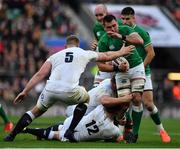 23 February 2020; CJ Stander of Ireland is tackled by Owen Farrell and George Kruis of England during the Guinness Six Nations Rugby Championship match between England and Ireland at Twickenham Stadium in London, England. Photo by Brendan Moran/Sportsfile