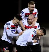 24 February 2020; Jordan Flores of Dundalk, bottom, celebrates with team-mates, from left, Darragh Leahy, Chris Shields and Sean Hoare after scoring his side's third goal during the SSE Airtricity League Premier Division match between Dundalk and Cork City at Oriel Park in Dundalk, Louth. Photo by Seb Daly/Sportsfile