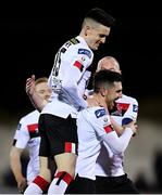 24 February 2020; Jordan Flores of Dundalk celebrates with team-mates Darragh Leahy, left, and Chris Shields after scoring his side's third goal during the SSE Airtricity League Premier Division match between Dundalk and Cork City at Oriel Park in Dundalk, Louth. Photo by Seb Daly/Sportsfile