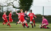 23 February 2020; DDSL goalkeeper Jack Ellis saves a shot on target despite the pressure of Dezell Obenge during the U13 SFAI Subway Liam Miller Cup National Championship Final match between Cork SL and DDSL at Mullingar Athletic FC in Gainestown, Co. Westmeath. Photo by Eóin Noonan/Sportsfile